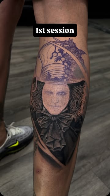 Black and grey portrait tattoo on the calf after a first session
